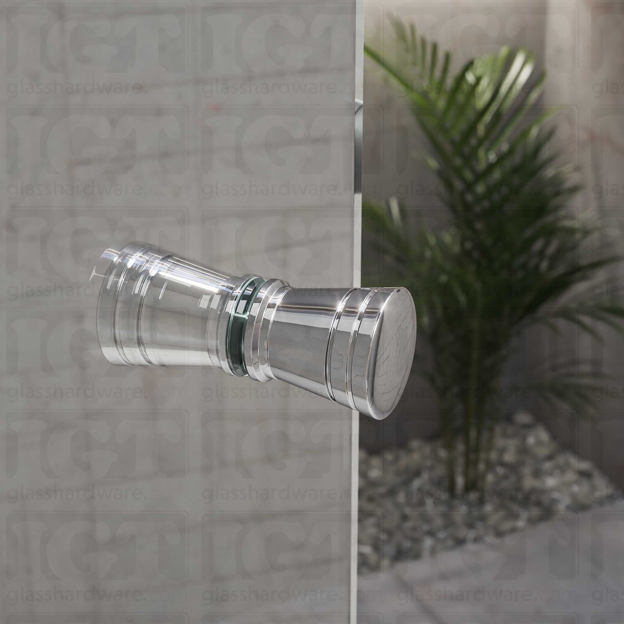 A close up of the Modern Ribbed Bow Tie Back-to-Back Door Knob installed on a glass shower door. The door knob's back-to-back design is tightly secured to the glass door. Chrome Polished.