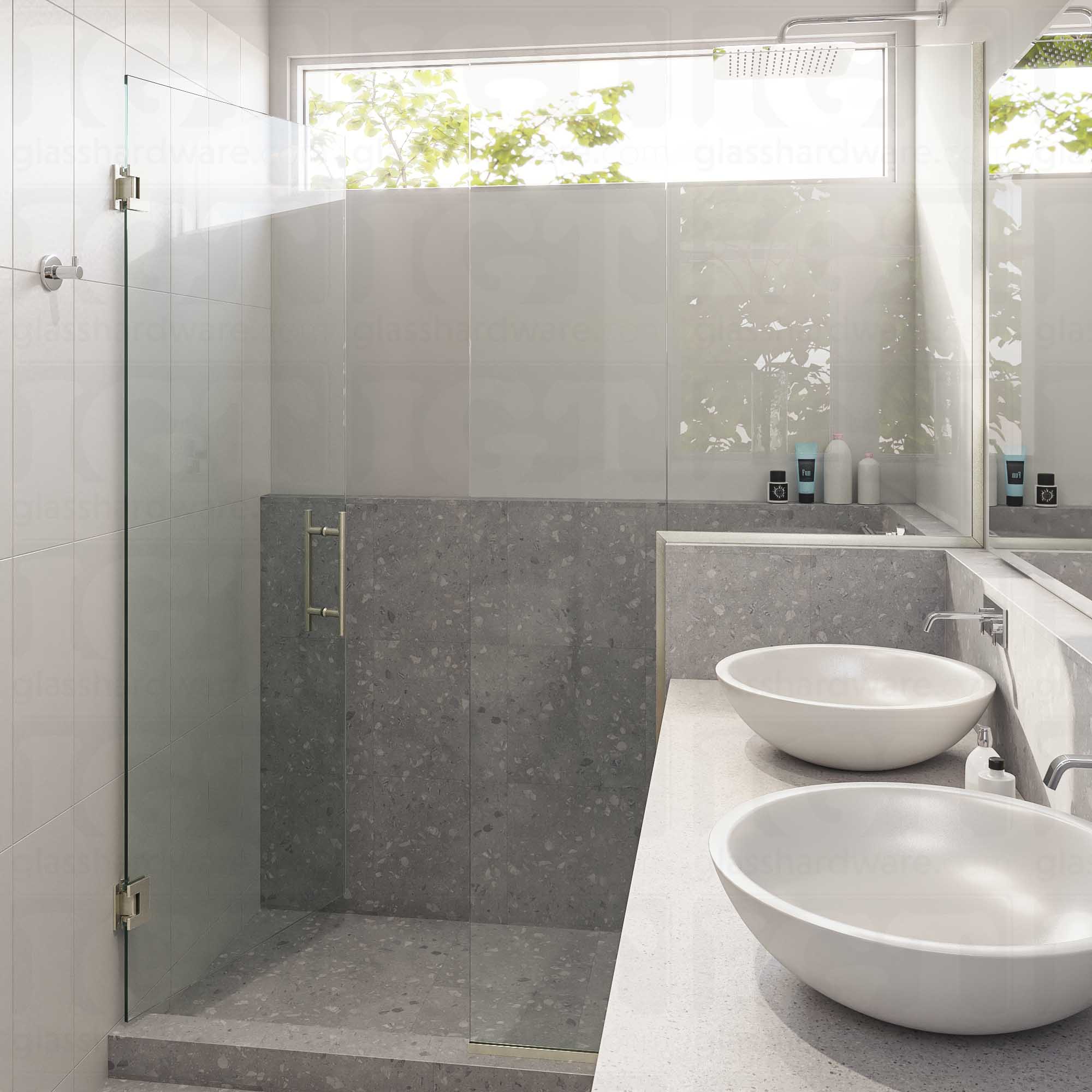 A modern bathroom with a semi-frameless glass shower enclosure featuring the 8" Center-to-Center Round Ladder Handle. Brushed Nickel.