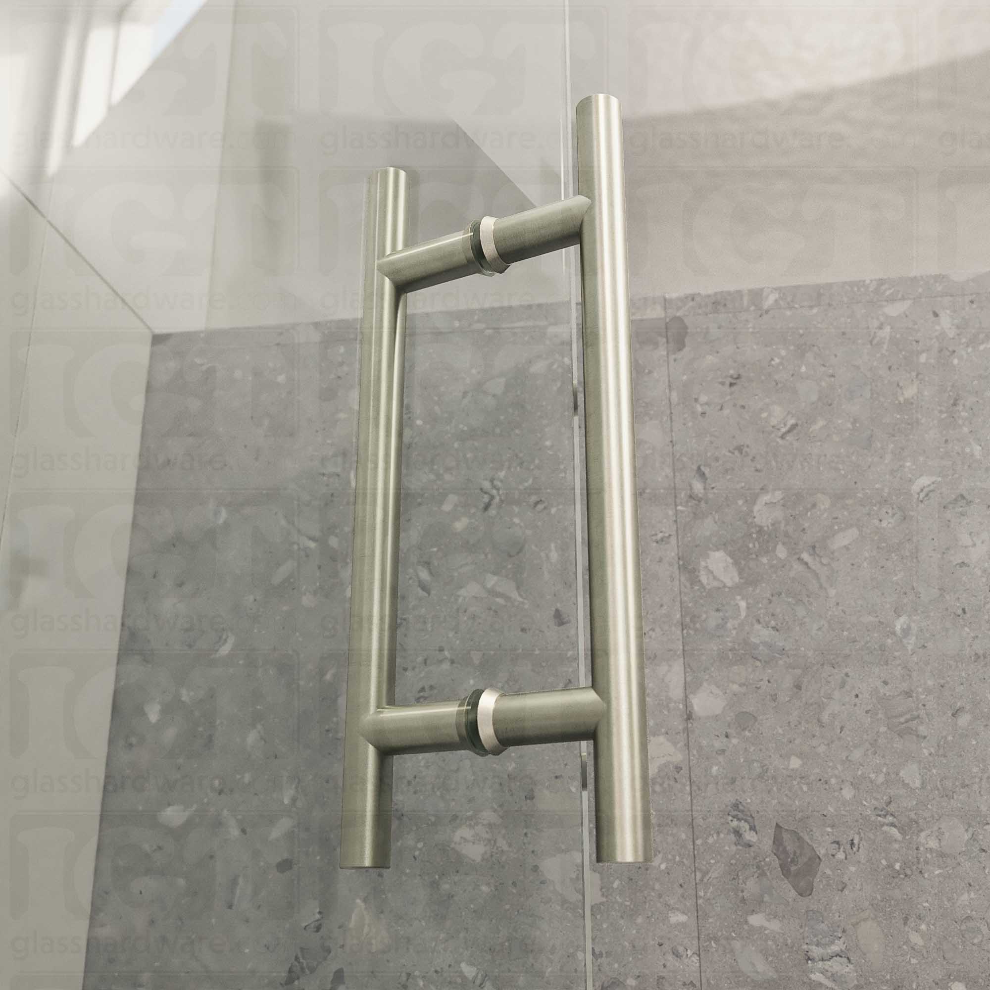 A close-up from of the 8" Center-to-Center Round Ladder Handle installed on a frameless glass shower door, showcasing its slim ladder style design. Brushed Nickel.