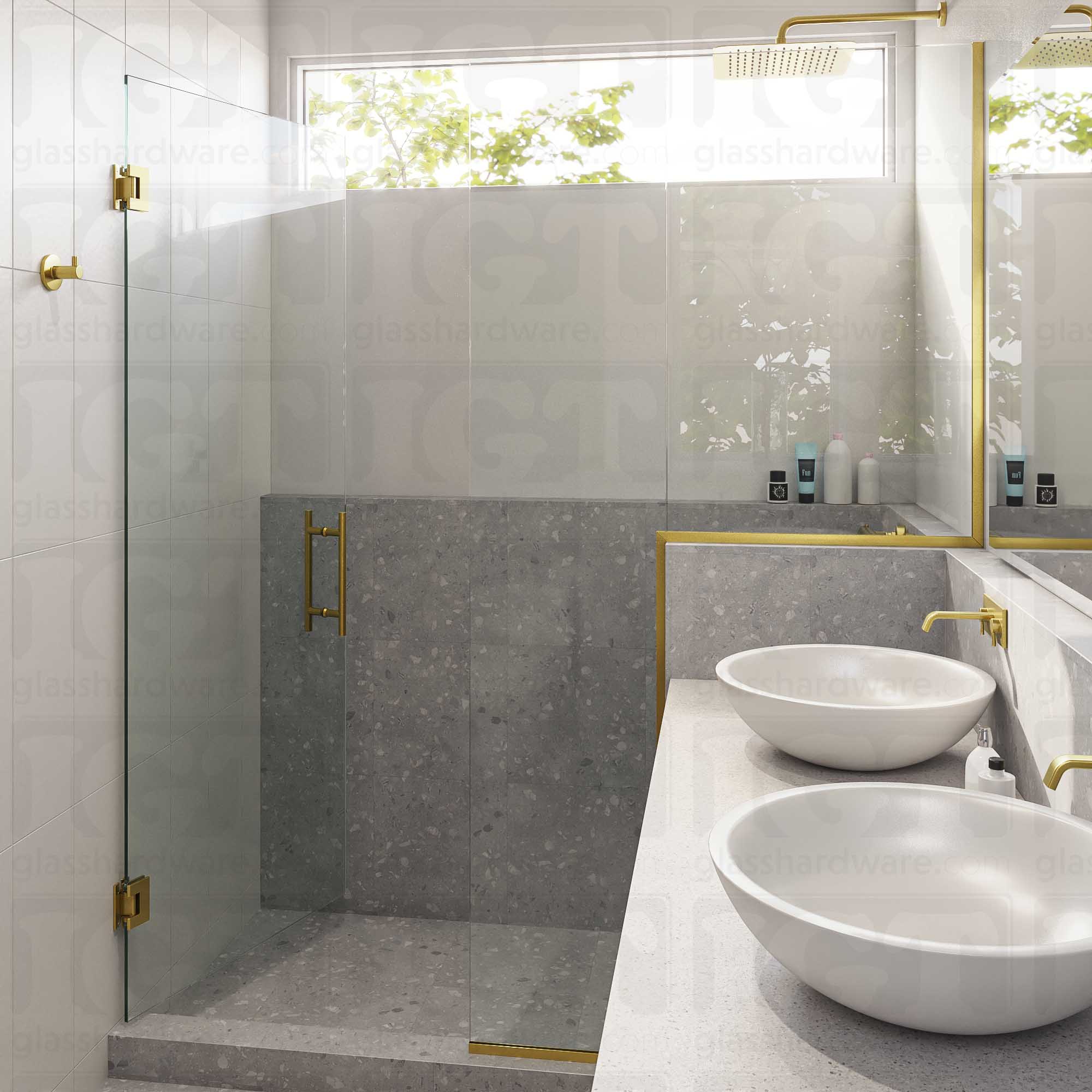 A modern bathroom with a semi-frameless glass shower enclosure featuring the 8" Center-to-Center Round Ladder Handle. Gold Brushed.