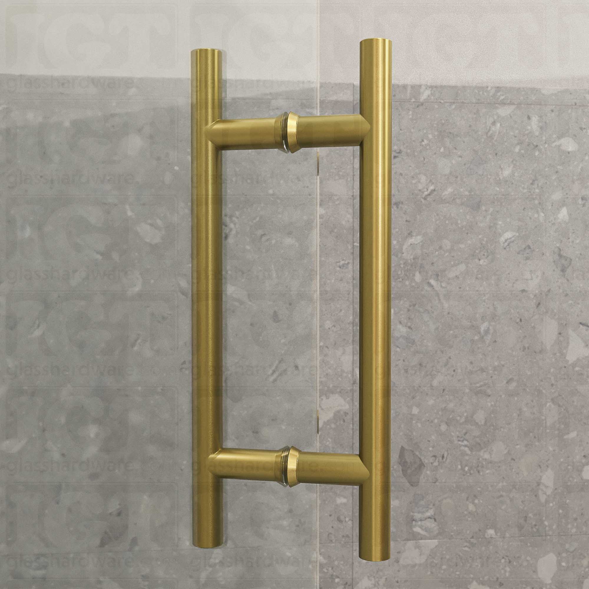 A close-up from of the 8" Center-to-Center Round Ladder Handle installed on a frameless glass shower door, showcasing its slim ladder style design. Gold Brushed.