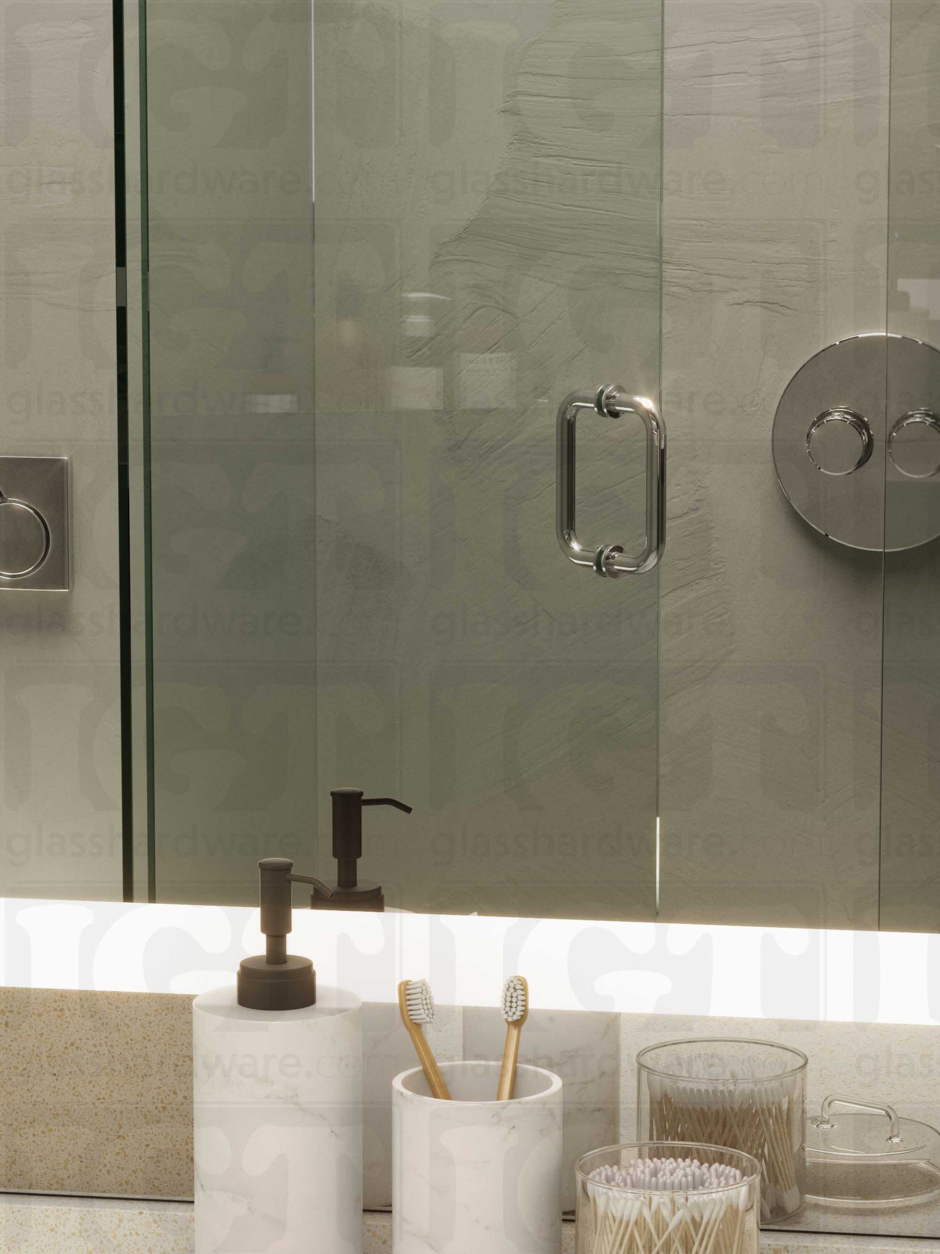 A frameless glass shower door in the open position, featuring the 6" Round Pull Handle. Chrome Polished.