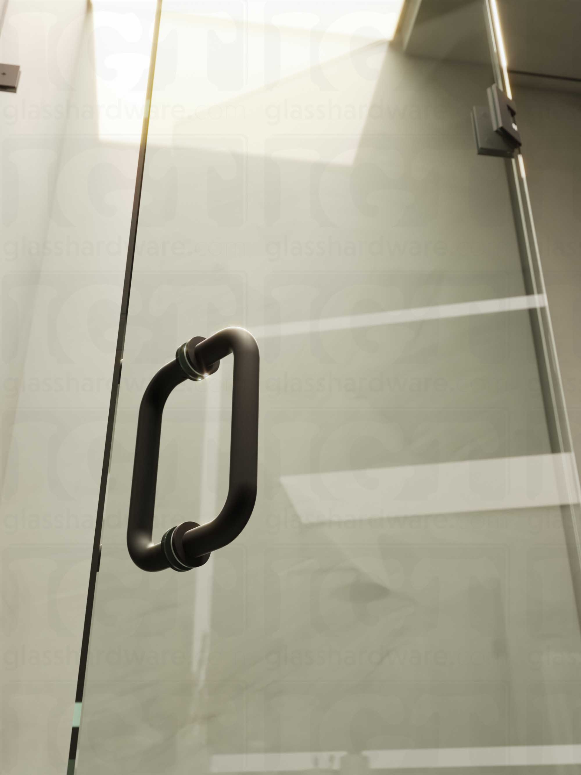 A close-up of the 6" Round Pull Handle installed on a frameless glass shower door, showcasing it's 304 Stainless Steel construction. Matte Black.