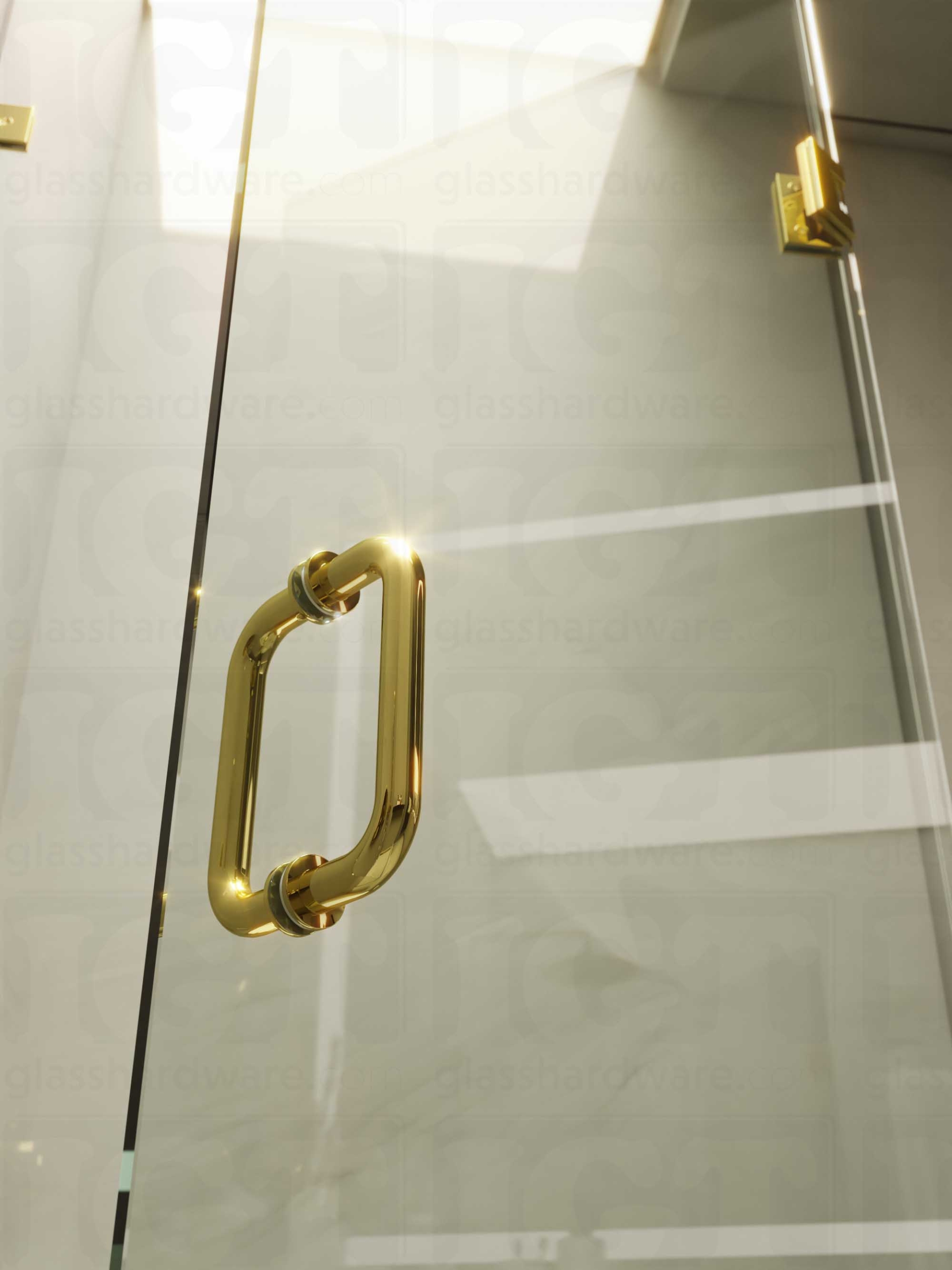 A close-up of the 6" Round Pull Handle installed on a frameless glass shower door, showcasing it's 304 Stainless Steel construction. Polished Brass.