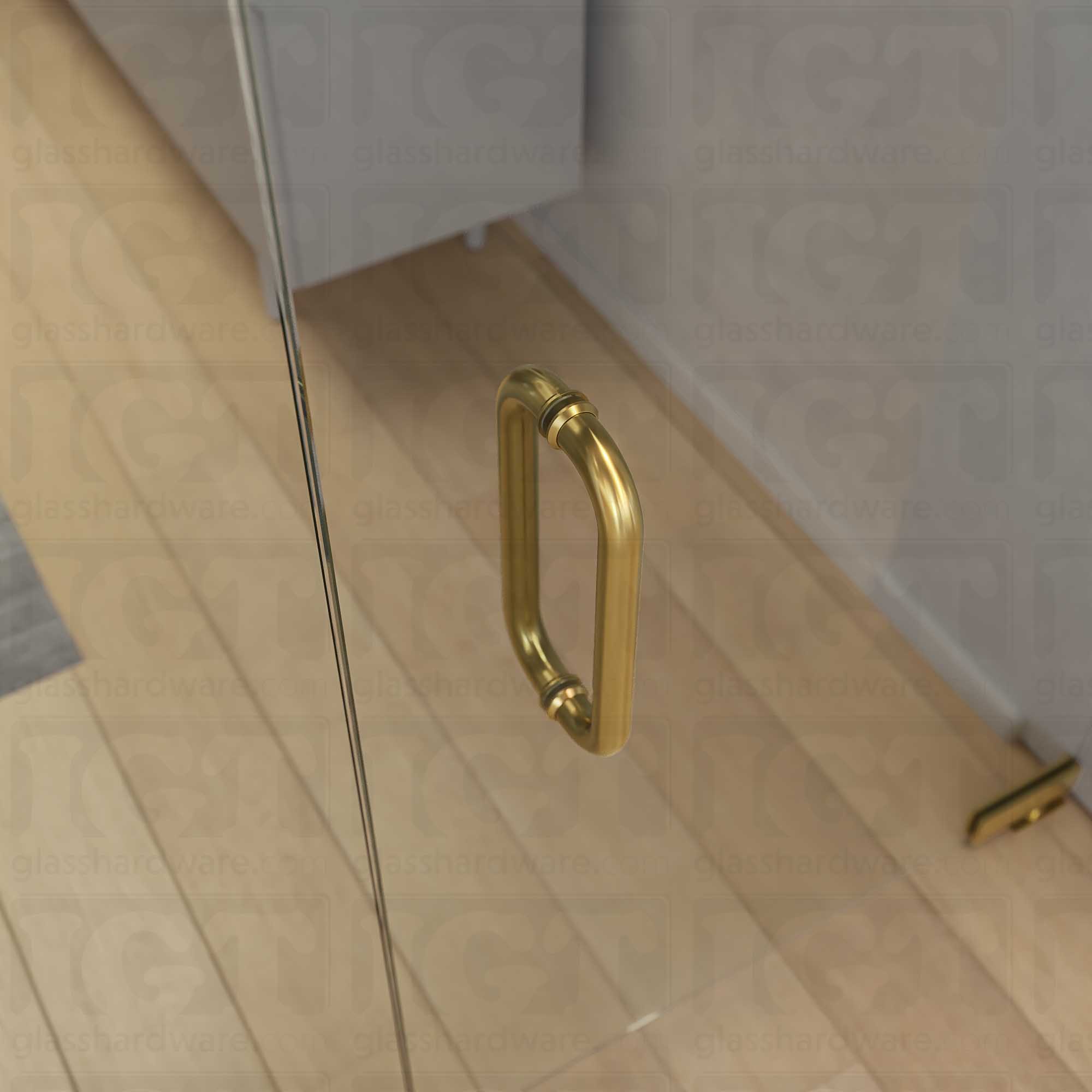 A close-up from above of the 12-inch Back-to-Back Tubular Pull Handle in Gold Brushed, installed on a commercial glass door.