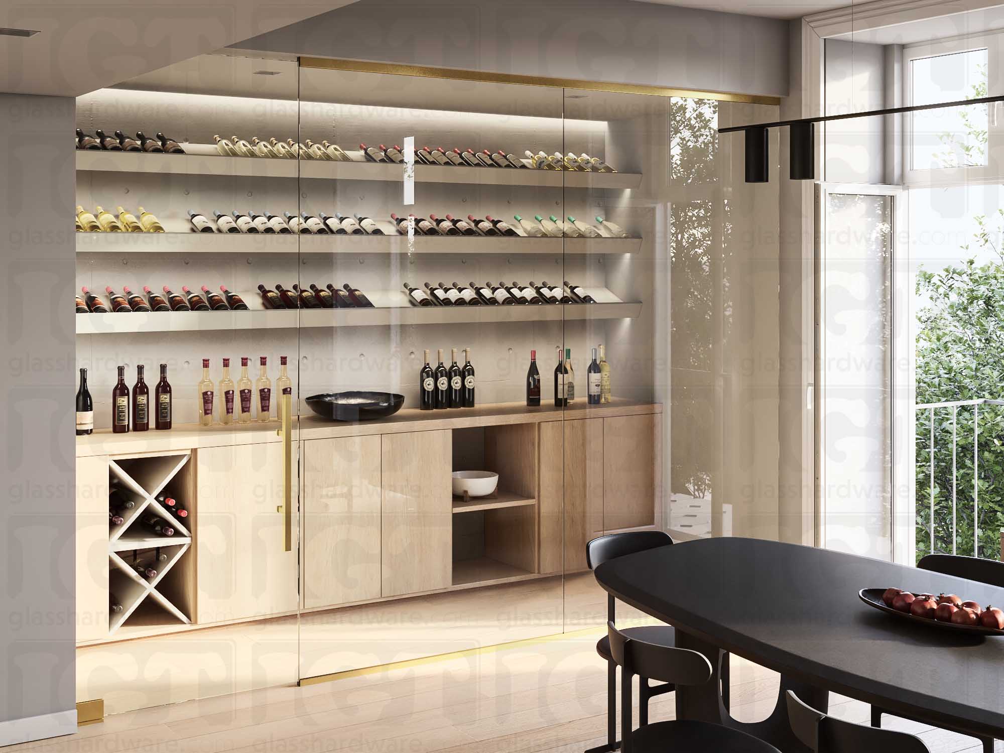 A wine storage room enclosed by a glass door partition with a ladder style handle. Gold Brushed.