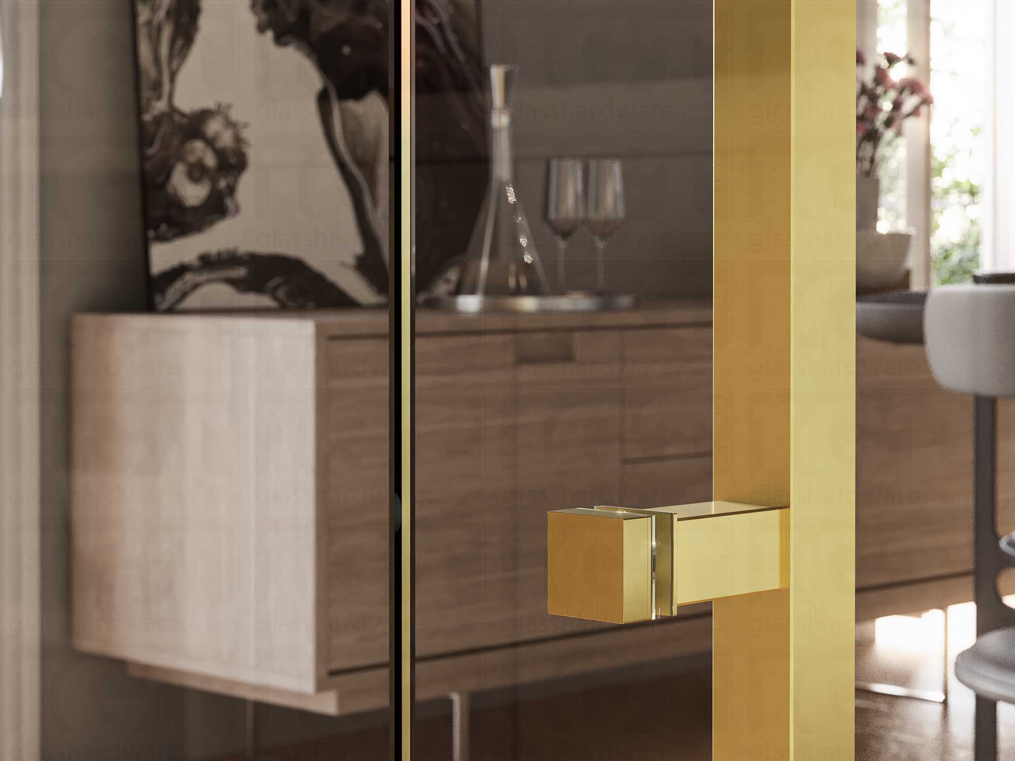 A close up of the Cap Fitting for Square Commercial Ladder Handle installed on a wine storage glass door. Gold Brushed.